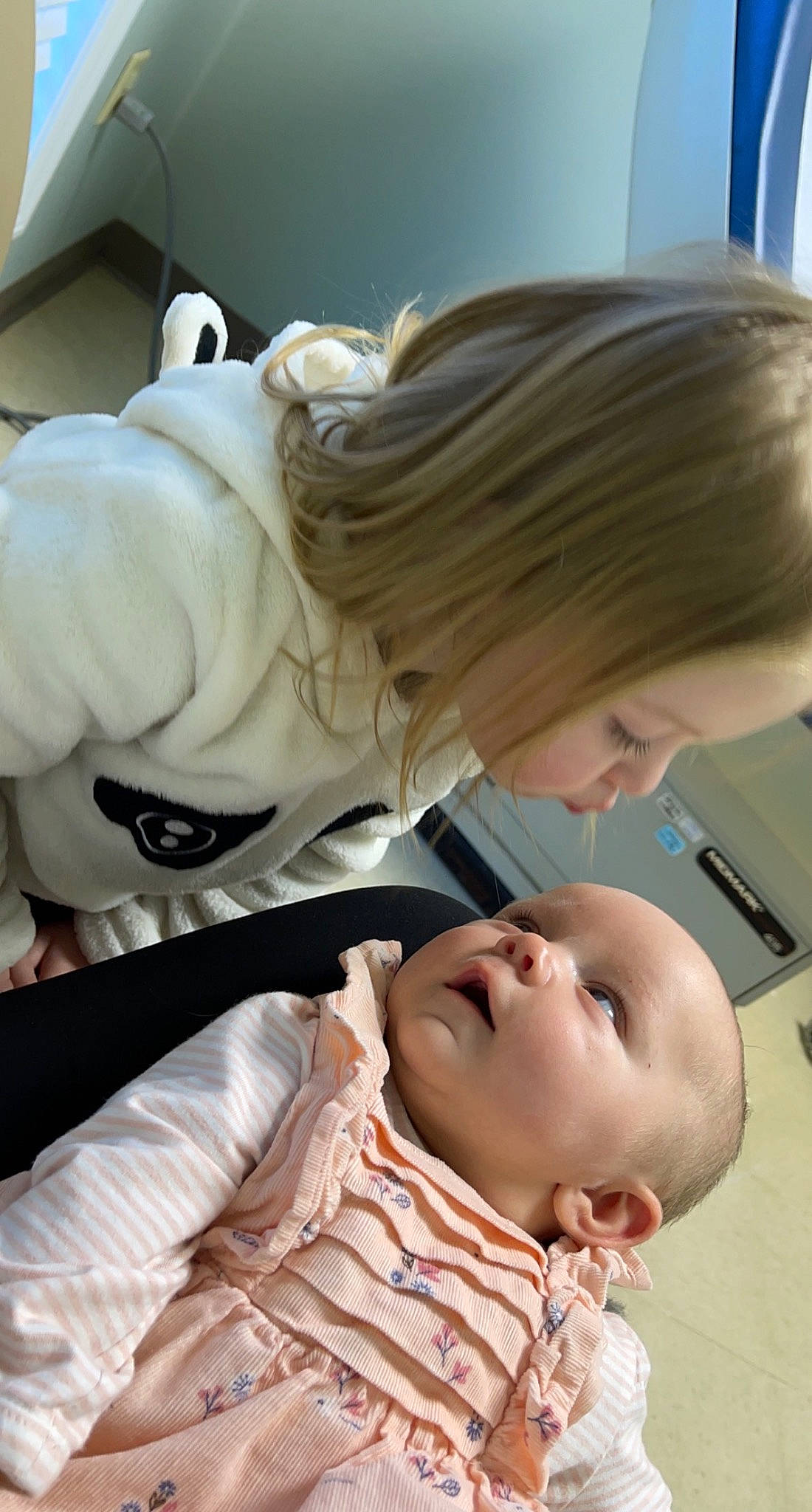 London is registered to the contest to win money with this photo: baby, blond, child, comfort, eyelash, fur, hairstyle, joint, layered_hair, linens, person, room, sitting, toddler