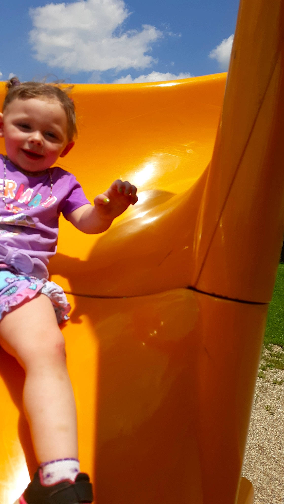 Nevaeh joined the competition — help win amazing prizes! child, chute, city, fun, human_settlement, inflatable, joy, leisure, outdoor_play_equipment, person, play, playground, playground_slide, public_space, recreation, smile, summer, toddler, vacation, yellow