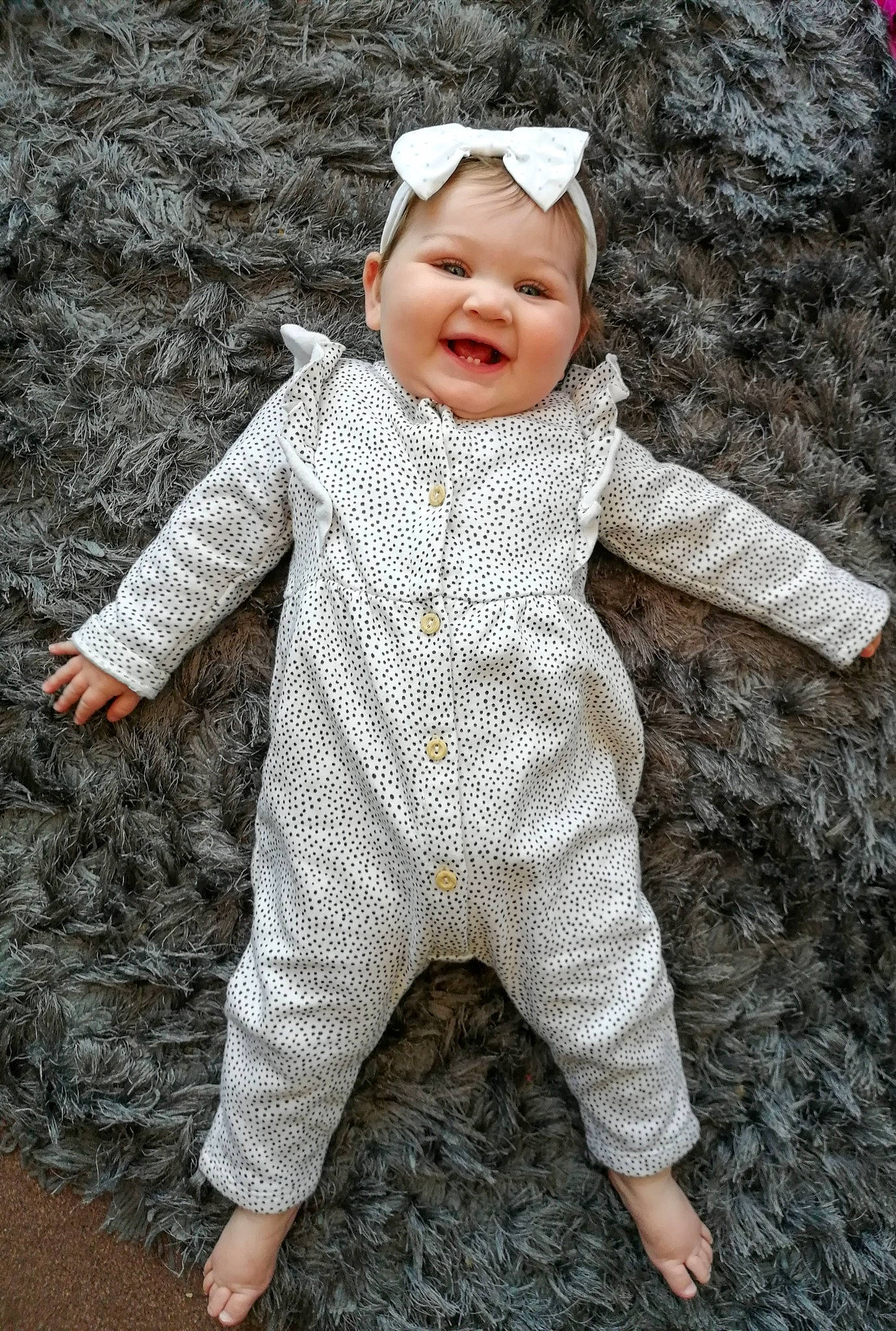 Darla is registered to the contest to win money with this photo: art, baby, baby_toddler_clothing, cap, child, eye, face, fun, fur, gesture, grass, happy, headwear, joy, pattern, people_in_nature, person, sleeve, smile, toddler