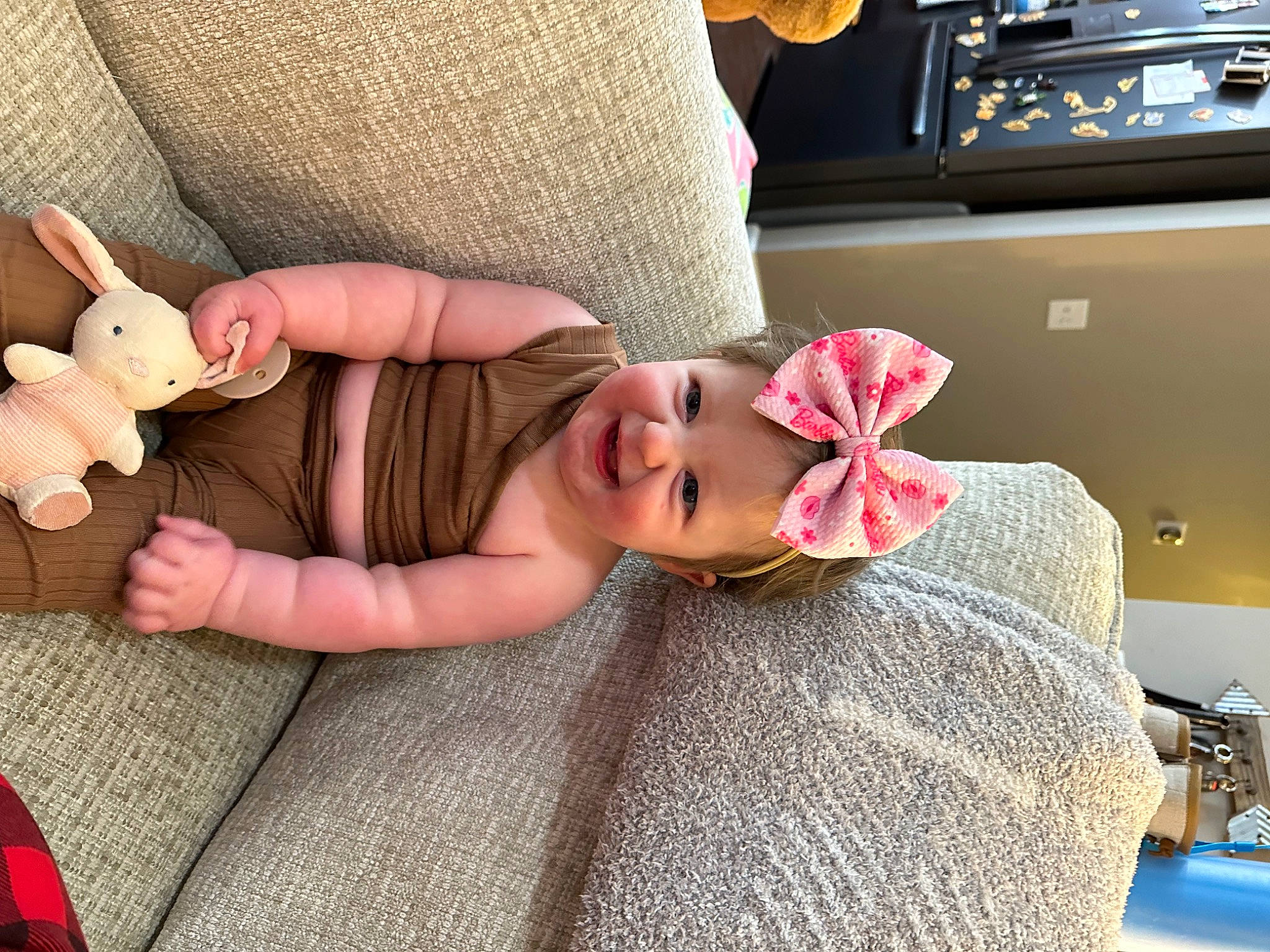 Stella is registered to the contest to win money with this photo: baby, baby_toddler_clothing, beauty, comfort, doll, fawn, finger, foot, hat, headwear, human_leg, joy, leg, linens, nail, person, pink, skin, sunglasses, textile
