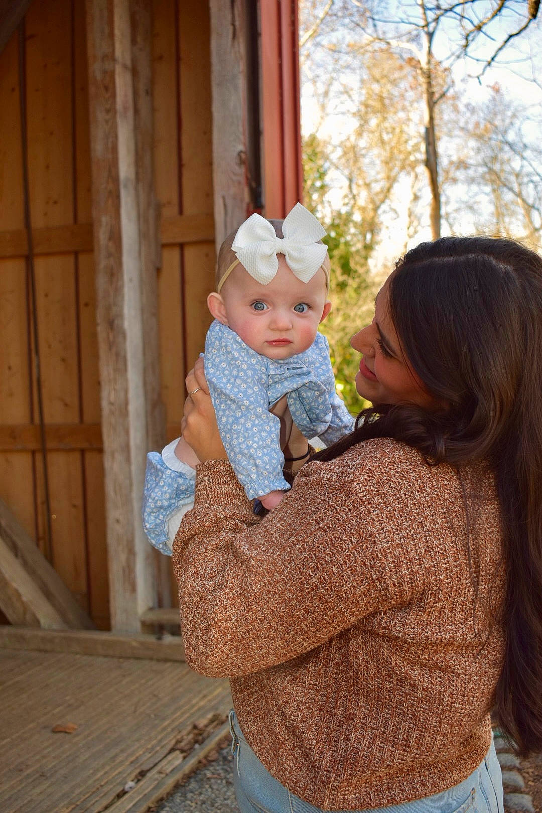 Elaine is registered to the contest to win money with this photo: baby, cap, child, event, fun, fur, gesture, grass, happy, headwear, hug, leisure, person, recreation, shoulder, sitting, skin, toddler, tree, vacation