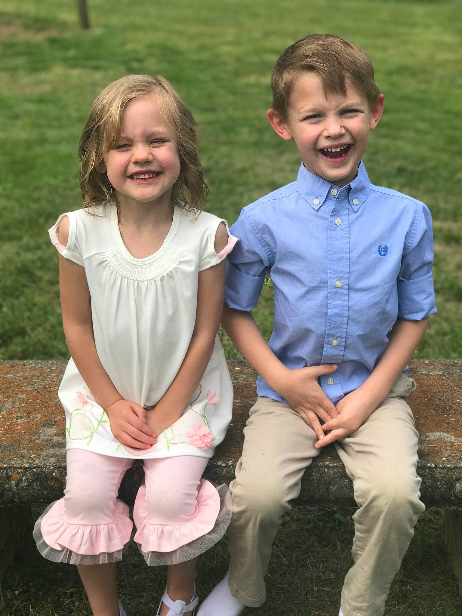 Wesley is registered to the contest to win money with this photo: child, family, gesture, grass, happy, joy, people, person, photograph, photography, play, portrait, sibling, sitting, smile, spring, summer, toddler, vacation