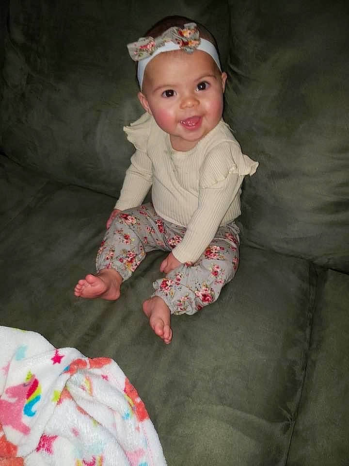 Adalyn is registered to the contest to win money with this photo: arm, baby_toddler_clothing, child, comfort, dress, eye, face, flash_photography, fun, happy, head, headwear, iris, joy, leg, lip, organ, person, pink, skin