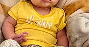 Lyla joined the competition — help win amazing prizes! baby, blanket, child, clothing, comfort, cute, expression, face, feet, floral_pants, hand, indoors, infant, person, portrait, scrunched_face, sitting, striped_blanket, yellow_shirt, young