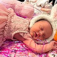 Lyla joined the competition — help win amazing prizes! newborn, baby, sleeping, pink_dress, lace, bunny_hat, carrot, blanket, ribbons, soft_toys, cute, infant, portrait, sleep, resting, adorable, cozy, cradle, child, toddler