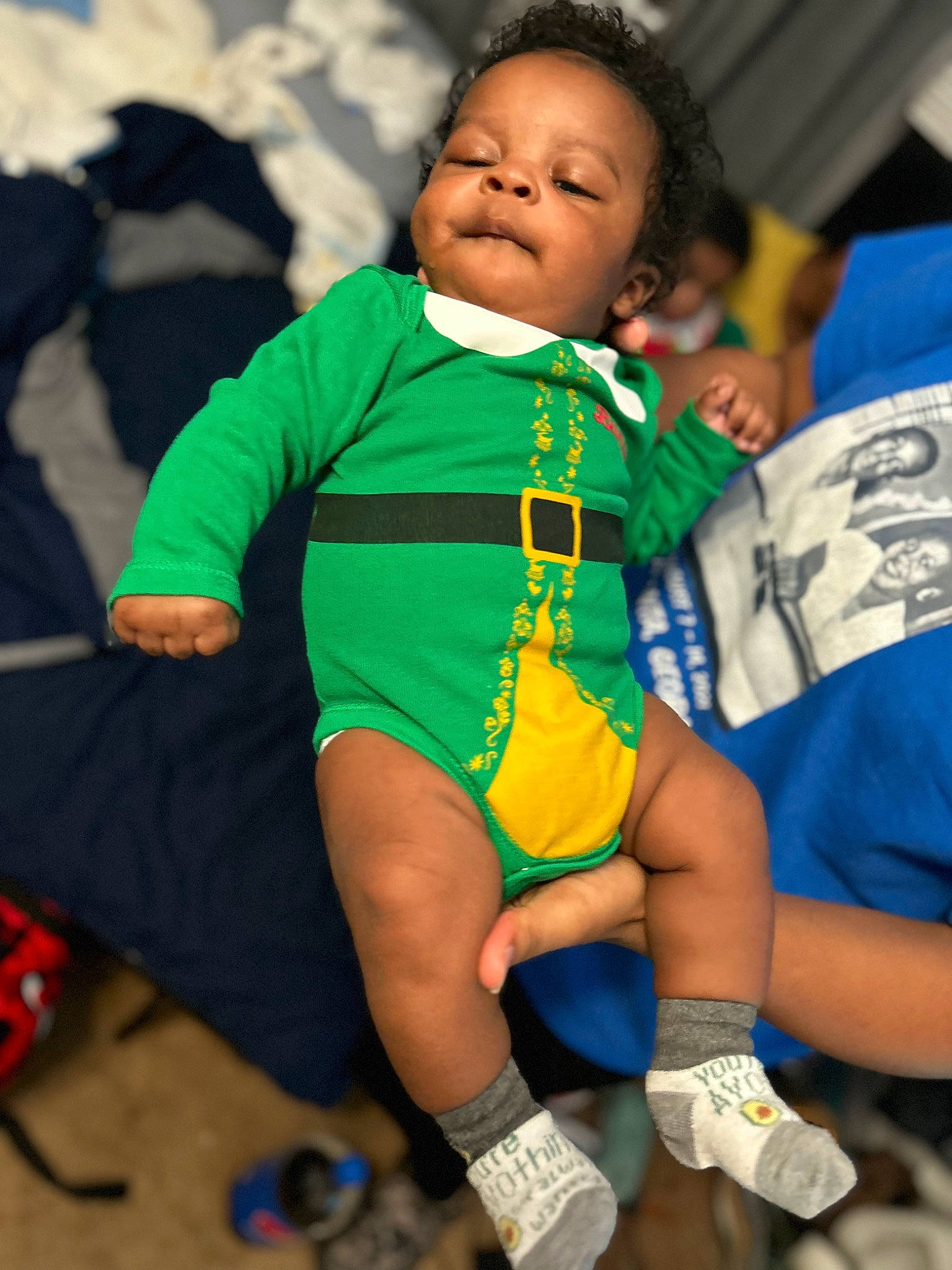 Junior is registered to the contest to win money with this photo: baby, baby_toddler_clothing, child, competition_event, dress, event, eye, fictional_character, fun, happy, head, human_leg, joy, leisure, person, recreation, sitting, sleeve, sportswear, t_shirt