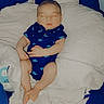 Jasper is registered to the contest to win money with this photo: baby, sleeping, blue_onesie, blanket, owl_pillow, infant, turtle_prints, cozy, cute, soft_texture, bed, child, peaceful, indoors, resting, newborn, comfort, portrait, blue, white