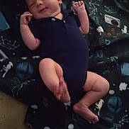 Jasper joined the competition — help win amazing prizes! baby, infant, onesie, blanket, carpet, smile, face, skin, limbs, child, newborn, cute, indoors, floor, pattern, clothing, lying_down, happy, small, young