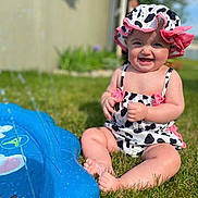 Wrenley is registered to the contest to win money with this photo: baby, grass, water, sprinkler, swimsuit, hat, sunhat, outdoor, summer, child, smile, happy, sitting, water_splash, play, toy, sunny, cute, infant, nature