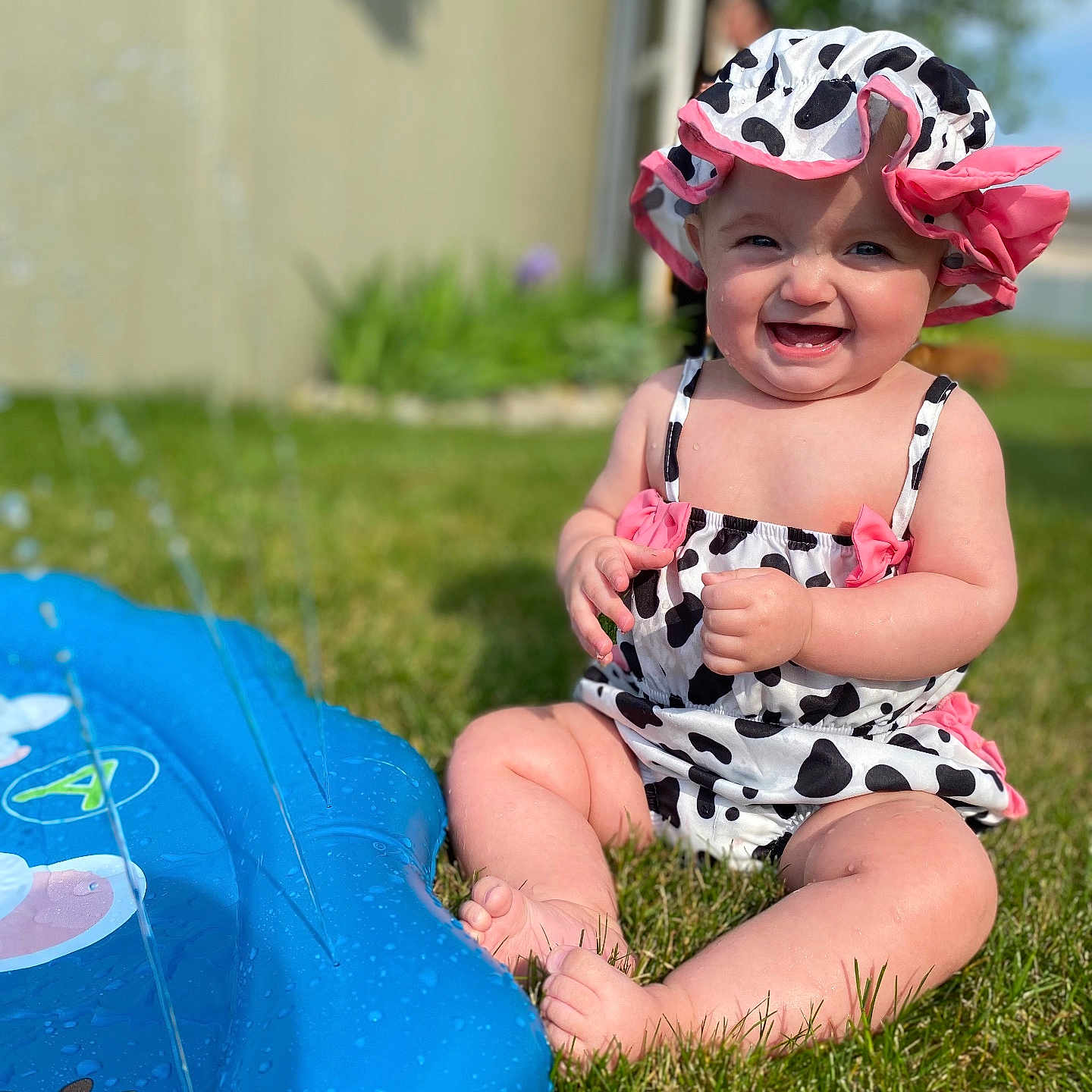 Wrenley is registered to the contest to win money with this photo: baby, child, cute, grass, happy, hat, infant, nature, outdoor, play, sitting, smile, sprinkler, summer, sunhat, sunny, swimsuit, toy, water, water_splash