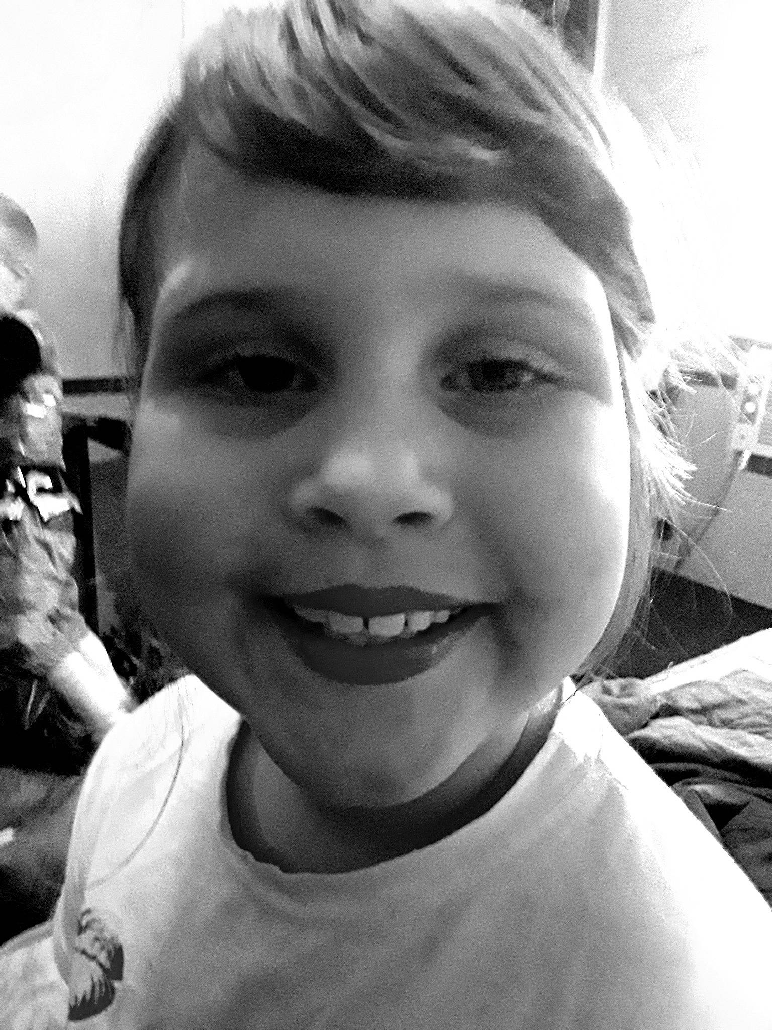 Katelynn is registered to the contest to win money with this photo: black_and_white, cheek, child, chin, cool, eye, eyebrow, face, facial_expression, forehead, hair, head, jaw, joy, lip, monochrome, mouth, nose, person, photography