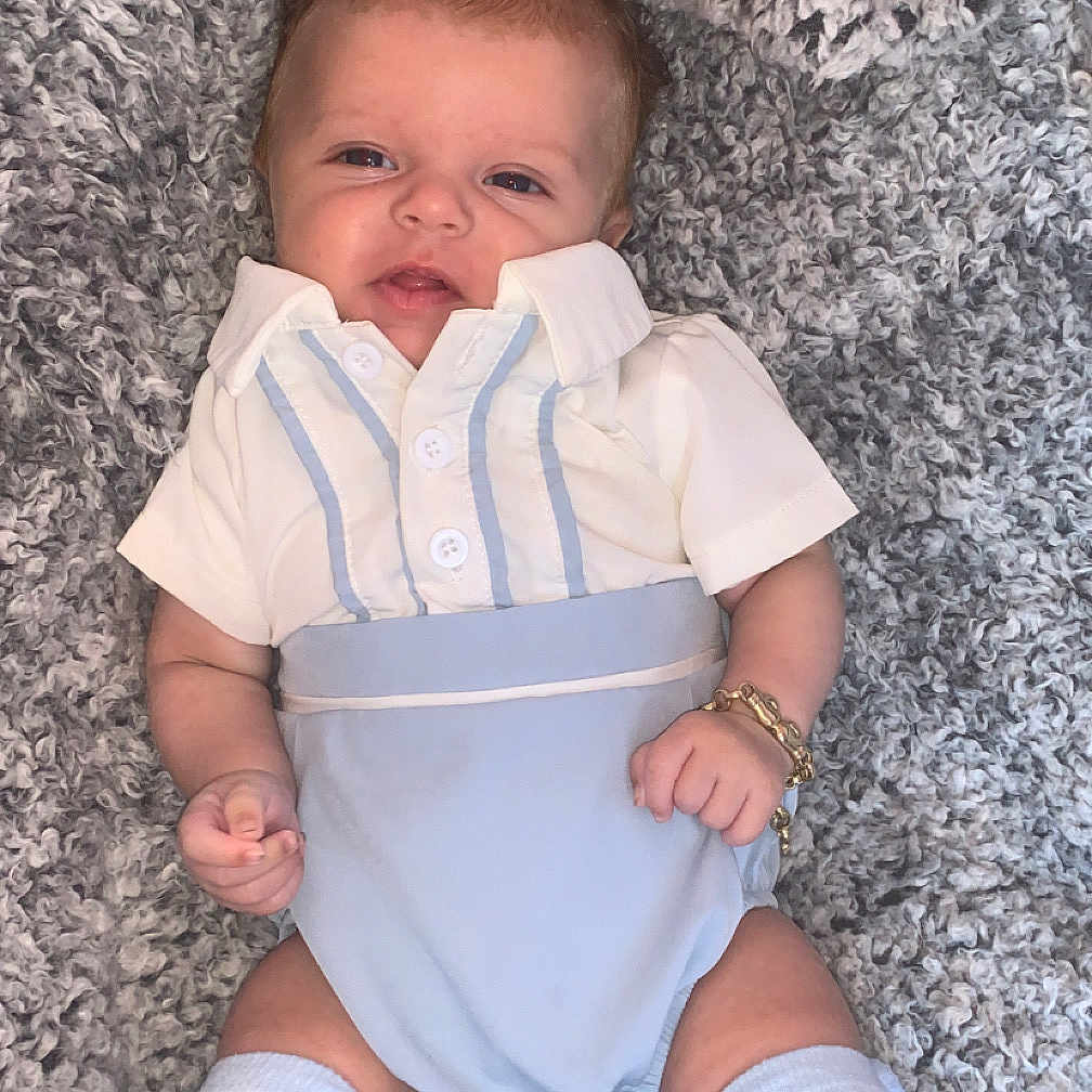 Acer is registered to the contest to win money with this photo: baby, blanket, blue_clothing, bracelet, child, cozy, cute, fashion, indoor, infant, kneehigh_socks, knit_socks, lying_down, person, portrait, relaxed, smiling, soft_texture, white_clothing, young_child