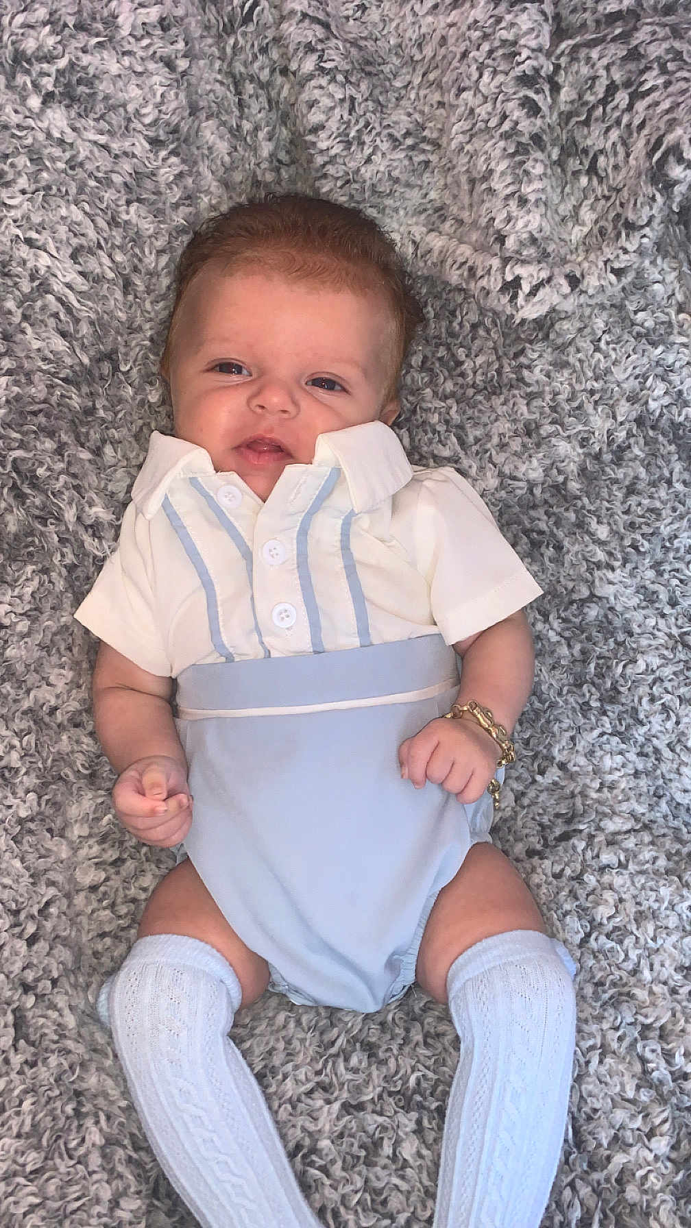 Acer is registered to the contest to win money with this photo: baby, blanket, blue_clothing, bracelet, child, cozy, cute, fashion, indoor, infant, kneehigh_socks, knit_socks, lying_down, person, portrait, relaxed, smiling, soft_texture, white_clothing, young_child