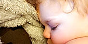 Jaxon Robert is registered to the contest to win money with this photo: bangs, brown_hair, chest, comfort, doll, ear, eye, eyelash, fawn, finger, gesture, head, headgear, jaw, lip, long_hair, neck, red_hair, toy, wig