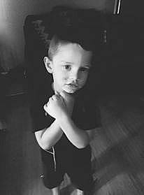 Travis Jr is registered to the contest to win money with this photo: black_and_white, child, face, head, monochrome, monochrome_photography, person, photograph, photography, portrait, shoulder, smile, snapshot, standing, style