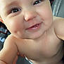 Navy is registered to the contest to win money with this photo: baby, smiling, close_up, face, dimples, eyes, skin, arm, foot, sitting, car_seat, child, infant, cute, happy, cheeks, mouth, tongue, indoors, person