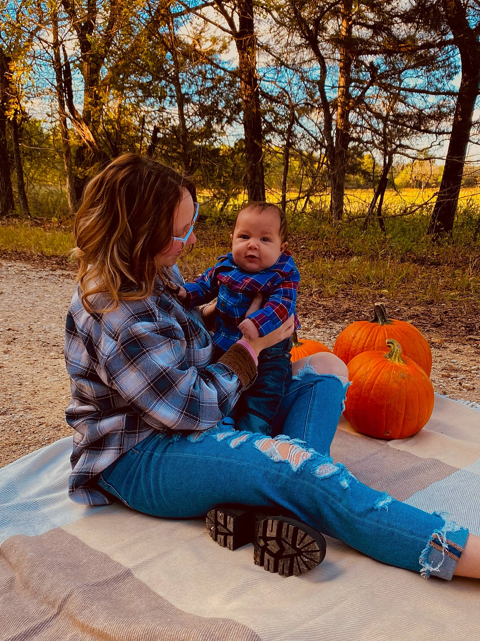 Everest is registered to the contest to win money with this photo: baby, calabaza, child, comfort, fun, gourd, grass, happy, leisure, morning, people_in_nature, person, plant, pumpkin, recreation, sitting, squash, toddler, tree, vegetable