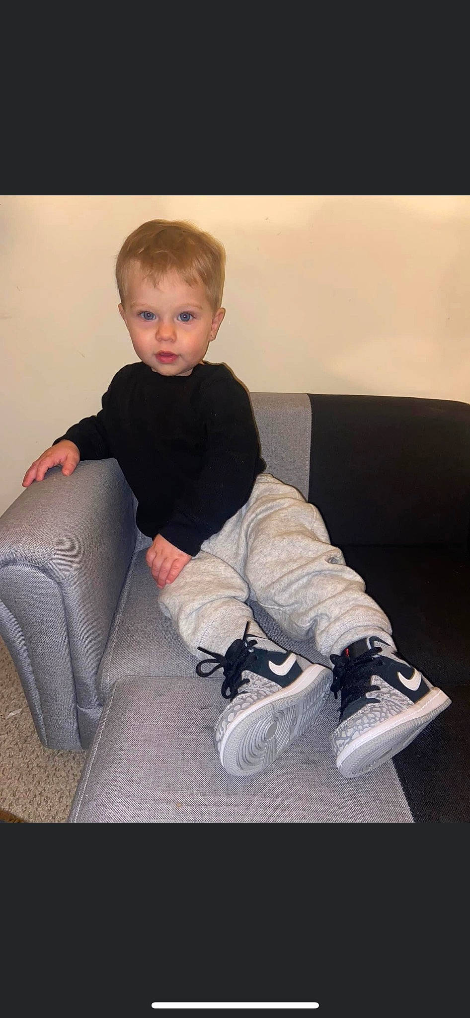Kamren is registered to the contest to win money with this photo: arm, baby_toddler_clothing, child, comfort, elbow, flash_photography, hair, human_leg, joint, knee, lap, leg, person, shoe, sitting, sleeve, sneakers, sock, t_shirt, thigh