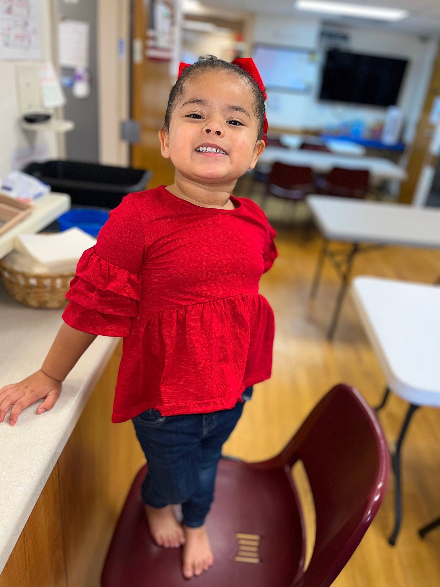 Kalia joined the competition — help win amazing prizes! baby, baby_toddler_clothing, chair, child, event, flooring, fun, happy, joy, leisure, person, room, shorts, sitting, sleeve, t_shirt, table, thigh, toddler, wood