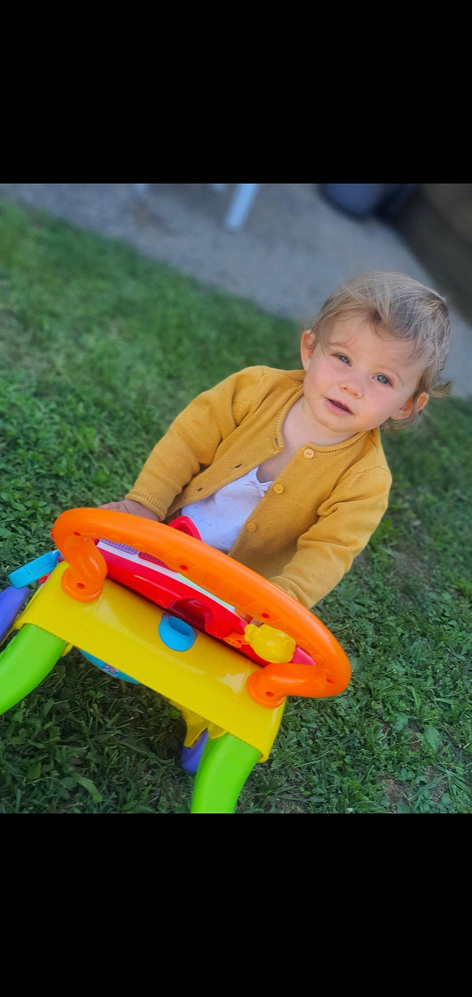Noëlya a rejoint le concours — aidez-le/la à gagner de superbes lots ! baby, baby_playing_with_toys, baby_toddler_clothing, child, flash_photography, fun, grass, happy, leisure, people_in_nature, person, plant, recreation, riding_toy, smile, tire, toddler, toy, tree, wheel