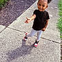 Joliyah is registered to the contest to win money with this photo: child, smiling, outdoor, sidewalk, hair_clips, butterfly, black_shirt, leggings, sneakers, grass, bushes, concrete, happy, person, cute, fashion, playful, portrait, daylight, shadow