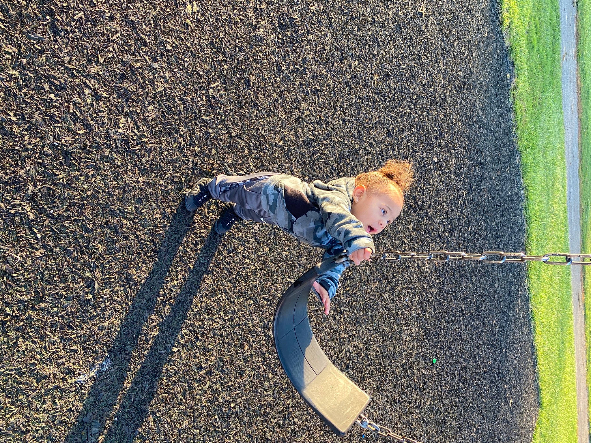 Deshawn is registered to the contest to win money with this photo: asphalt, balance, outdoor_play_equipment, people_in_nature, person, play, public_space, sand, shadow, walking_shoe