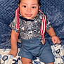 Cameron joined the competition — help win amazing prizes! baby, child, smile, shirt, suspenders, shorts, blanket, animal_pattern, blue, cute, indoors, portrait, infant, happy, feet, hands, face, clothing, person, sitting