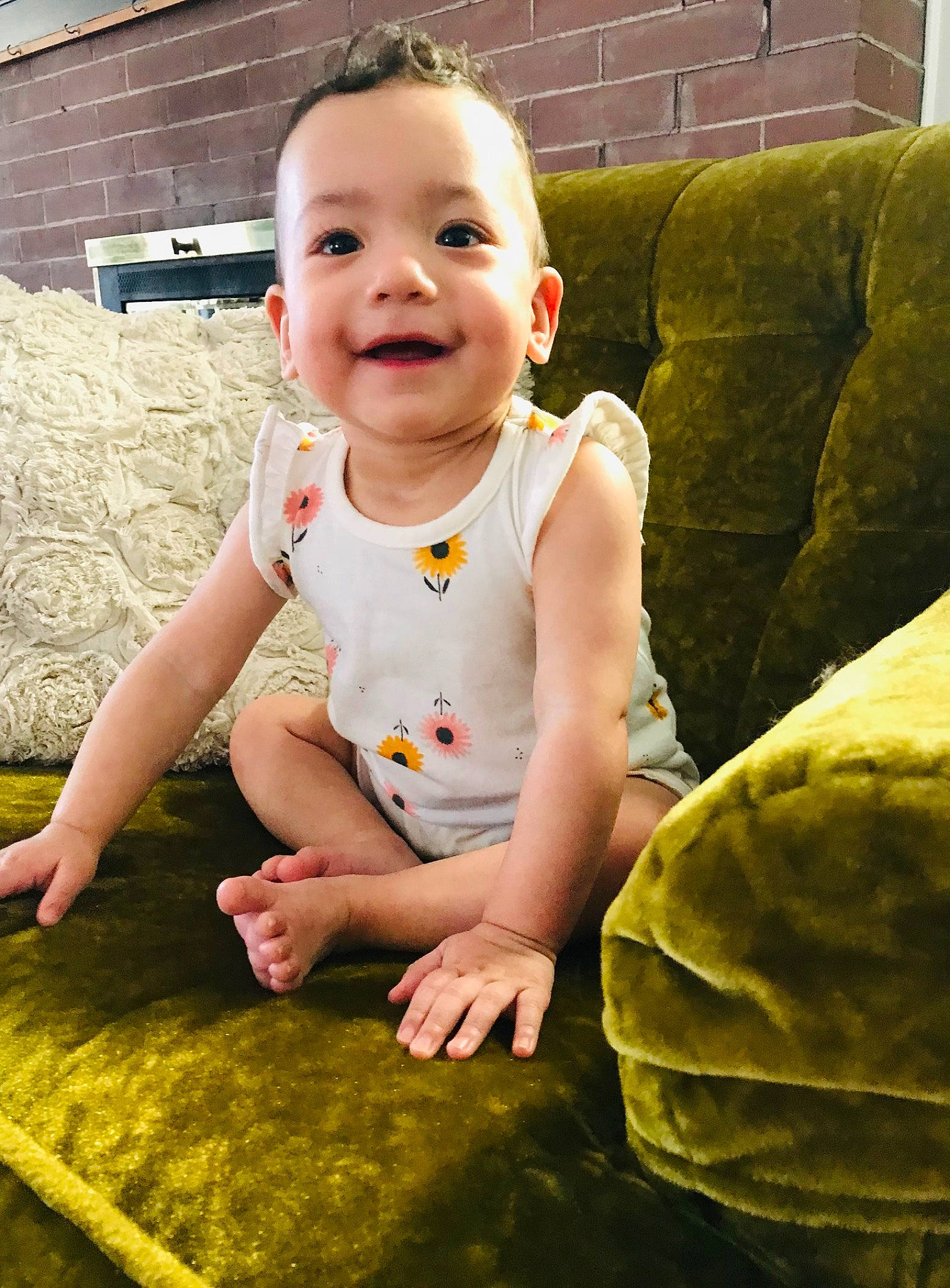 Sabrina is registered to the contest to win money with this photo: baby_toddler_clothing, cheek, couch, eye, face, facial_expression, finger, fun, grass, green, happy, head, joy, mammal, people, people_in_nature, person, skin, smile, standing