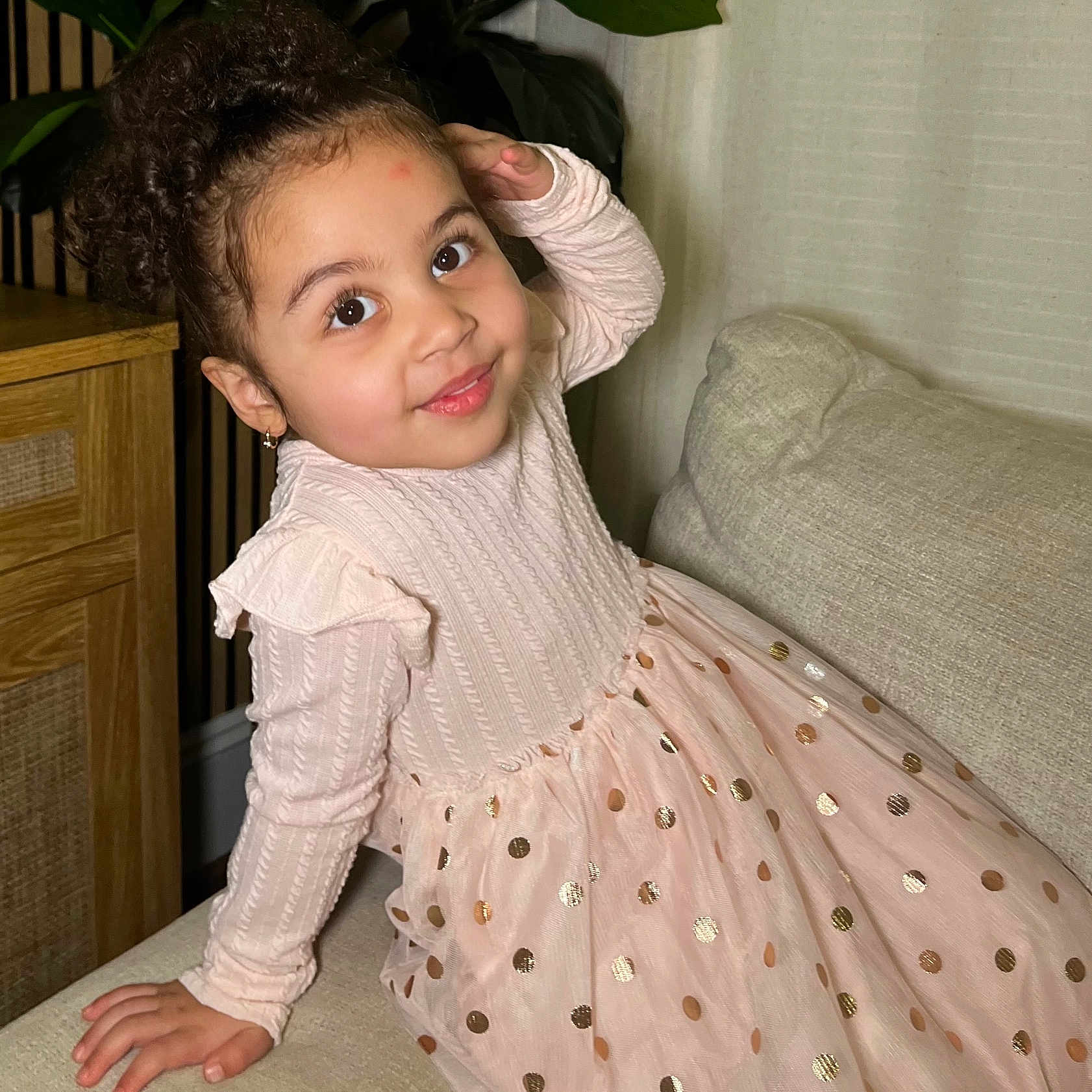 Luzmery joined the competition — help win amazing prizes! child, couch, cozy, curly_hair, cute, earrings, fashion, girl, happy, home_decor, indoor, long_sleeves, pink_dress, plant, polka_dots, portrait, sitting, smiling, wooden_cabinet, young