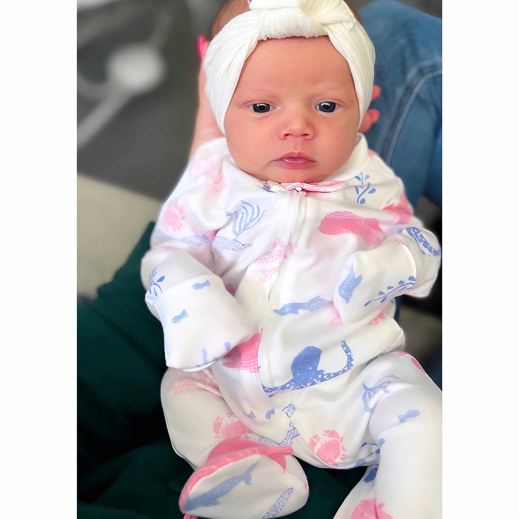 Jianna is registered to the contest to win money with this photo: accessories, baby, bonnet, cap, clothing, couch, doll, dress, face, formalwear, furniture, hat, head, headband, newborn, person, photography, portrait, sitting, toy