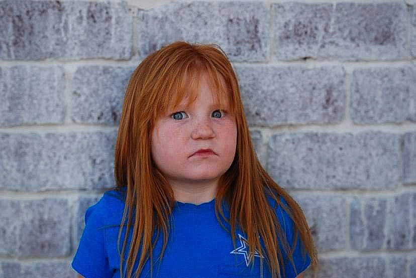 Adalynn is registered to the contest to win money with this photo: bangs, blond, brick, brown_hair, cheek, clothing, electric_blue, eye, eyelash, fun, hair, happy, head, iris, layered_hair, nose, person, step_cutting, surfer_hair, t_shirt