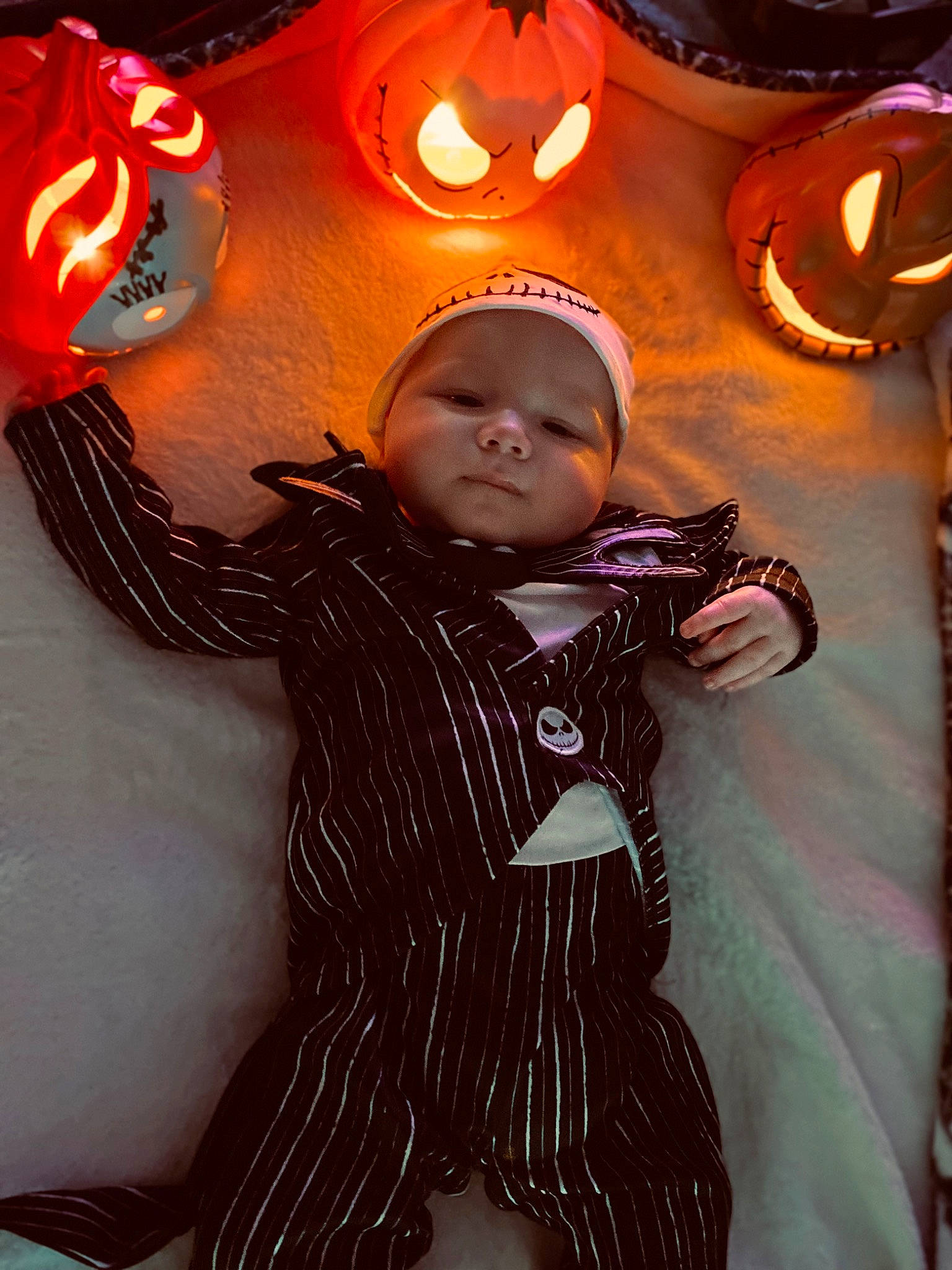 Jax is registered to the contest to win money with this photo: baby, baby_toddler_clothing, black, calabaza, child, cucurbita, design, event, facial_expression, flash_photography, fun, gesture, gourd, happy, head, person, pumpkin, sleeve, toddler, vegetable