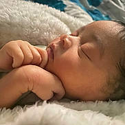 Emerie is registered to the contest to win money with this photo: baby, sleeping, newborn, hands, face, blanket, soft, closeup, peaceful, infant, cute, skin, portrait, rest, cozy, warm, child, young, toddler, bed