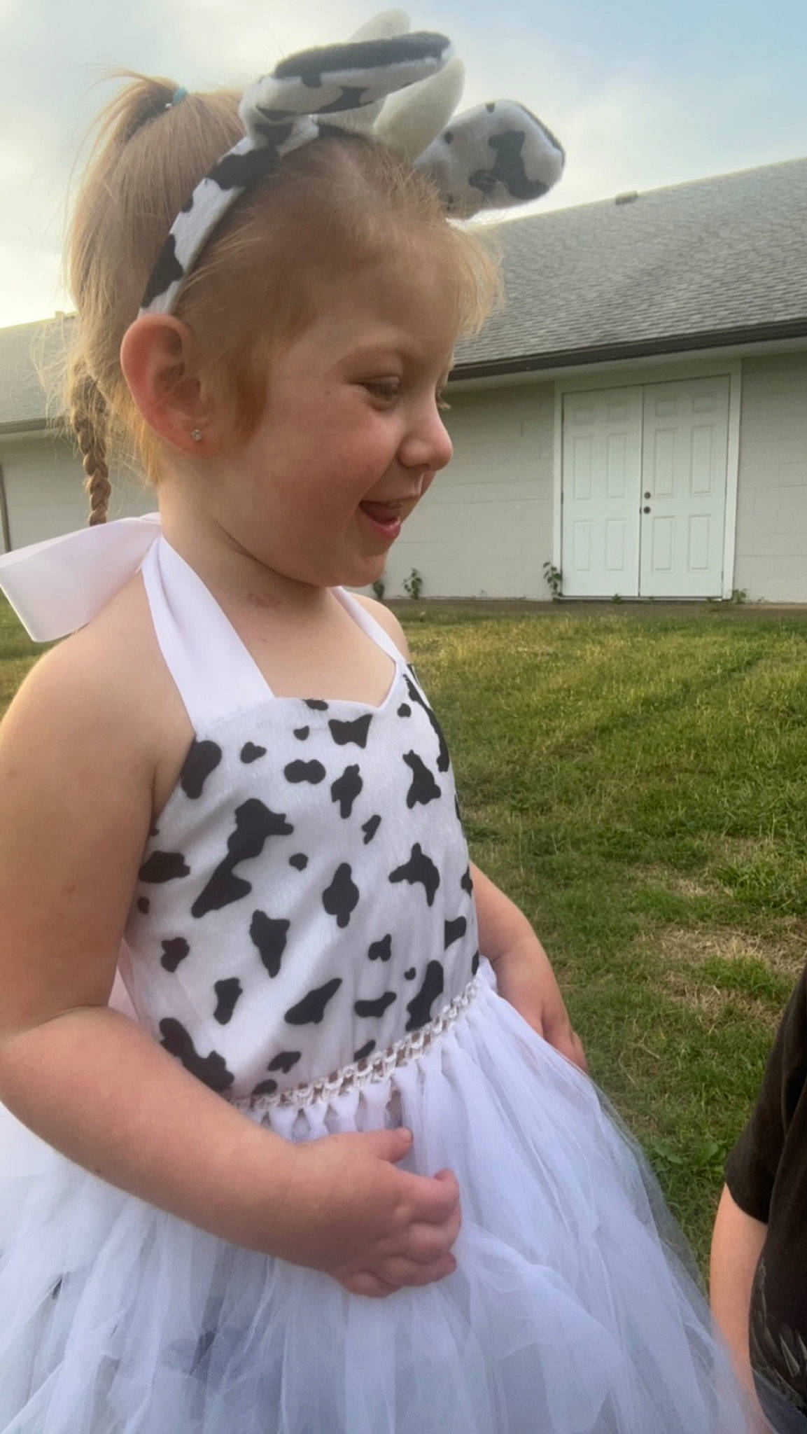 Octavia is registered to the contest to win money with this photo: baby_toddler_clothing, blond, child, day_dress, dress, facial_expression, grass, hair_tie, hairstyle, happy, neck, one_piece_garment, pattern, person, polka_dot, shoulder, sitting, sky, sleeve, toddler