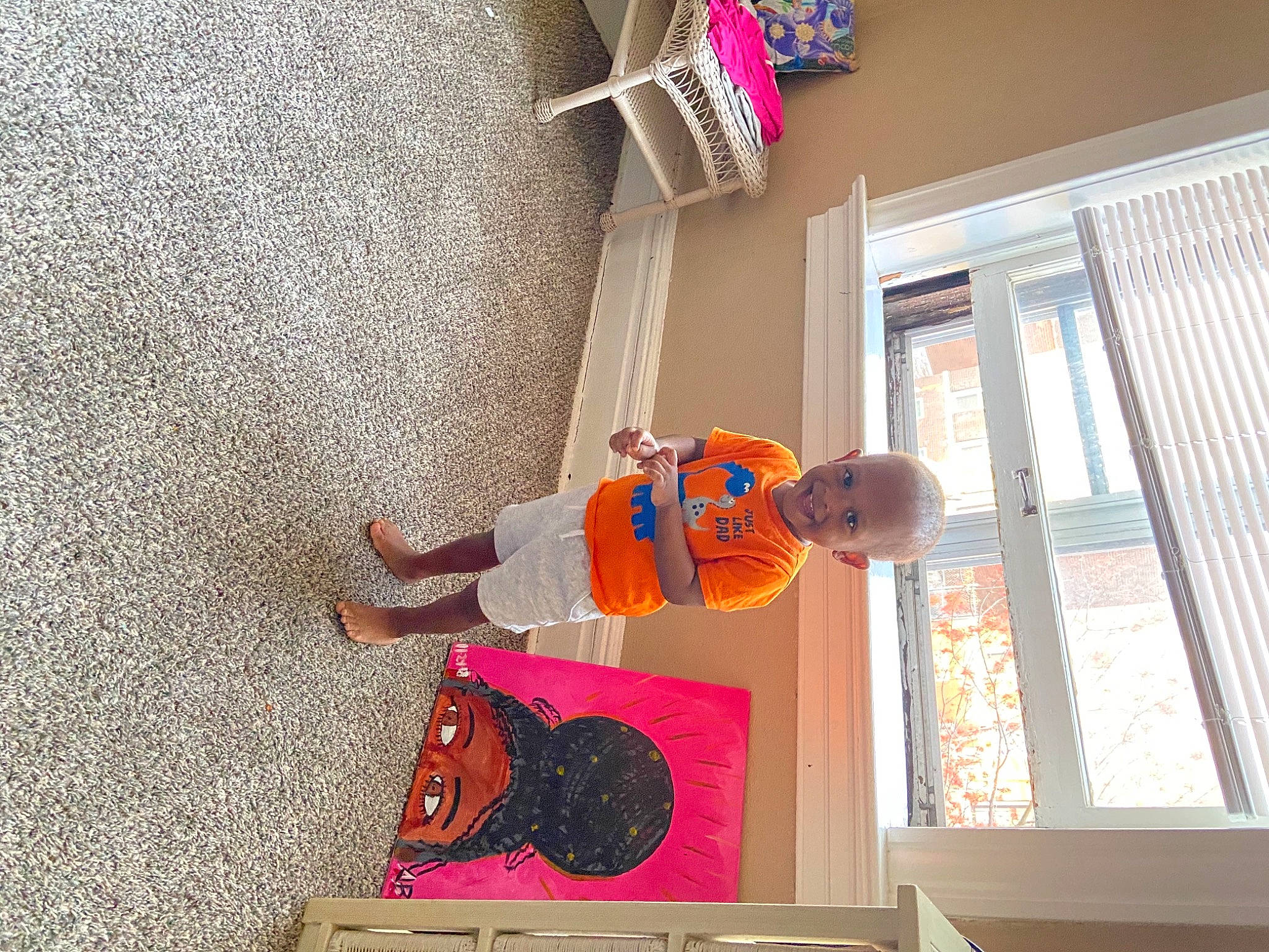 Yami is registered to the contest to win money with this photo: building, child, concrete, design, facade, flag_of_the_united_states, flooring, hat, house, joy, leisure, magenta, pattern, person, red, room, stairs, toddler, tree, window