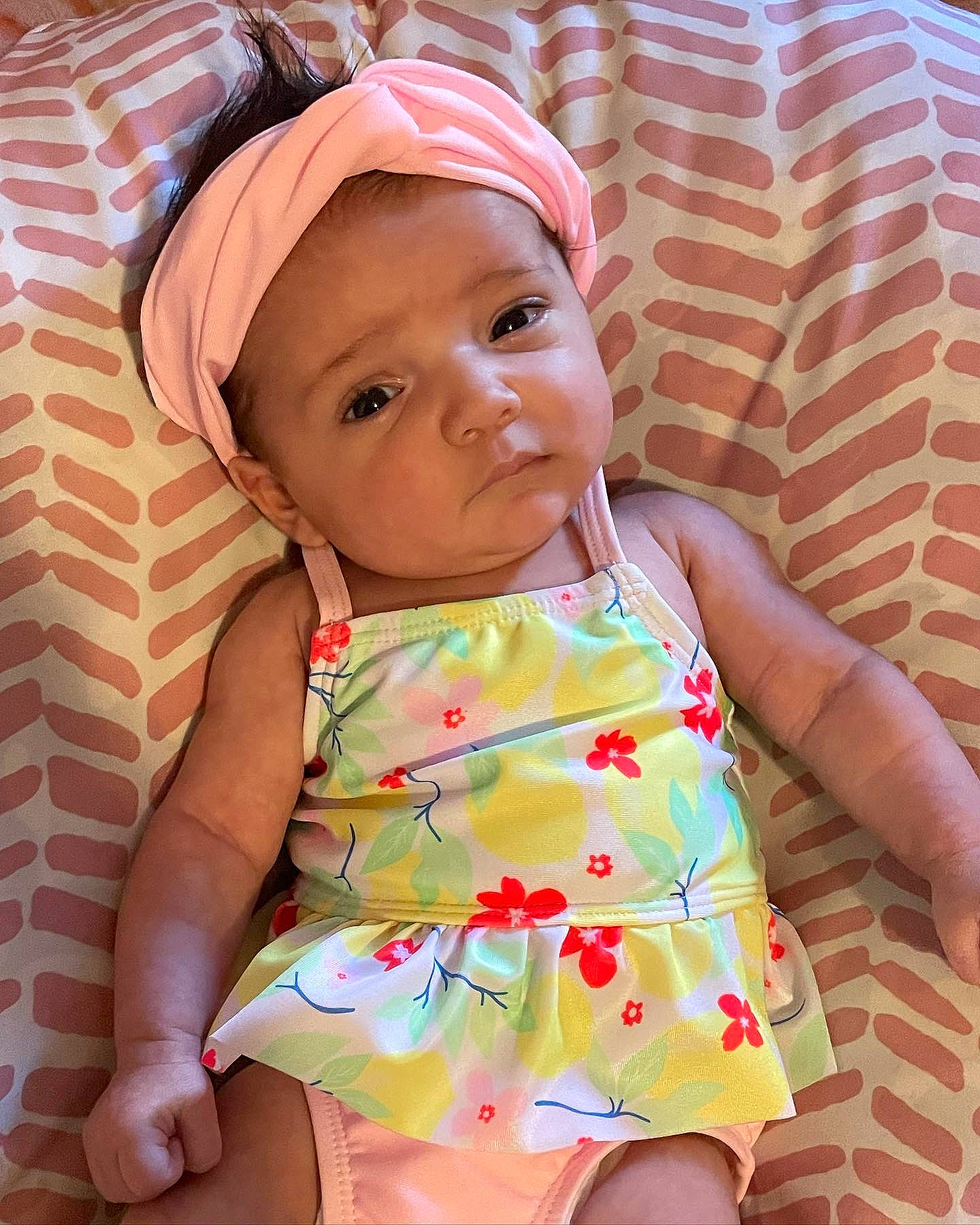 Marianna is registered to the contest to win money with this photo: baby, baby_toddler_clothing, cap, cheek, child, chin, day_dress, facial_expression, fun, happy, headwear, lip, neck, pattern, person, pink, product, skin, sleeve, textile