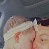 baby, child, adult, headband, car_interior, close_up, affection, face, nose_touching, pink_clothing, person, portrait, cute, intimacy, love, skin, eyewear, sunglasses, text_overlay, positive_message