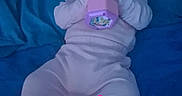 Angelina Ruby is registered to the contest to win money with this photo: adorable, baby, bed, blue_bedspread, child, cute, headband, heart_graphic, indoor, infant, lying_down, pajamas, person, pink_clothing, playtime, sleepwear, soft_lighting, text_overlay, time_stamp, toy