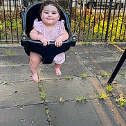 Arya joined the competition — help win amazing prizes! baby, swing, playground, child, smile, outdoor, park, fence, trees, grass, sunlight, rubber_tiles, cute, fun, happy, summer, infant, clothing, legs, nature