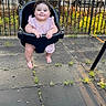 baby, swing, playground, child, smile, outdoor, park, fence, trees, grass, sunlight, rubber_tiles, cute, fun, happy, summer, infant, clothing, legs, nature