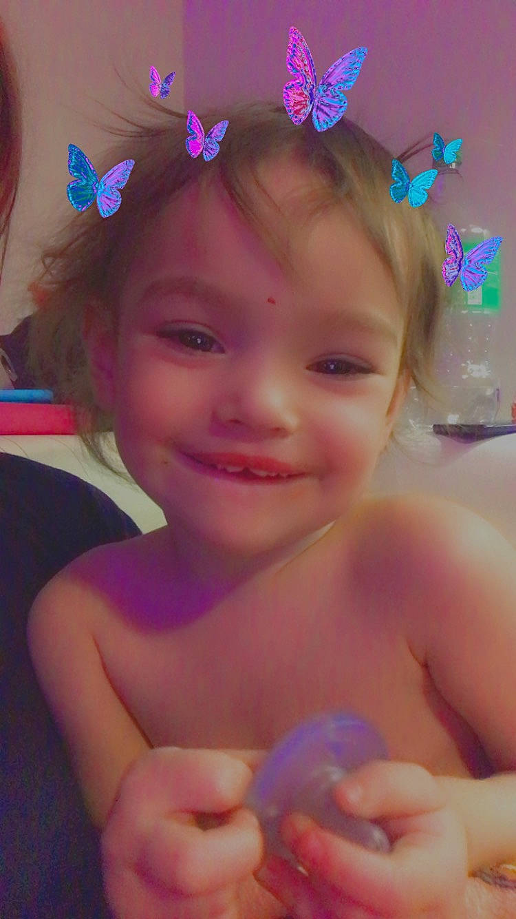 Aria joined the competition — help win amazing prizes! blue, child, eyebrow, eyelash, face, facial_expression, finger, fun, gesture, happy, headpiece, iris, joy, lip, person, pink, purple, skin, smile, thumb