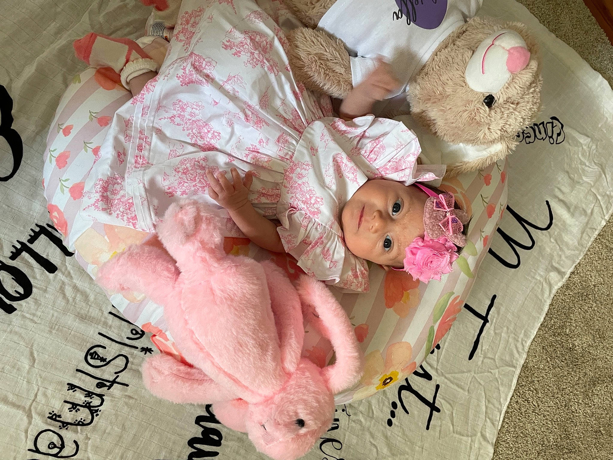 Gabriella joined the competition — help win amazing prizes! baby, baby_products, baby_sleeping, baby_toddler_clothing, bed_sheet, bedding, bedtime, child, comfort, flesh, font, happy, headwear, linens, magenta, person, photo_caption, pink, room, teddy_bear