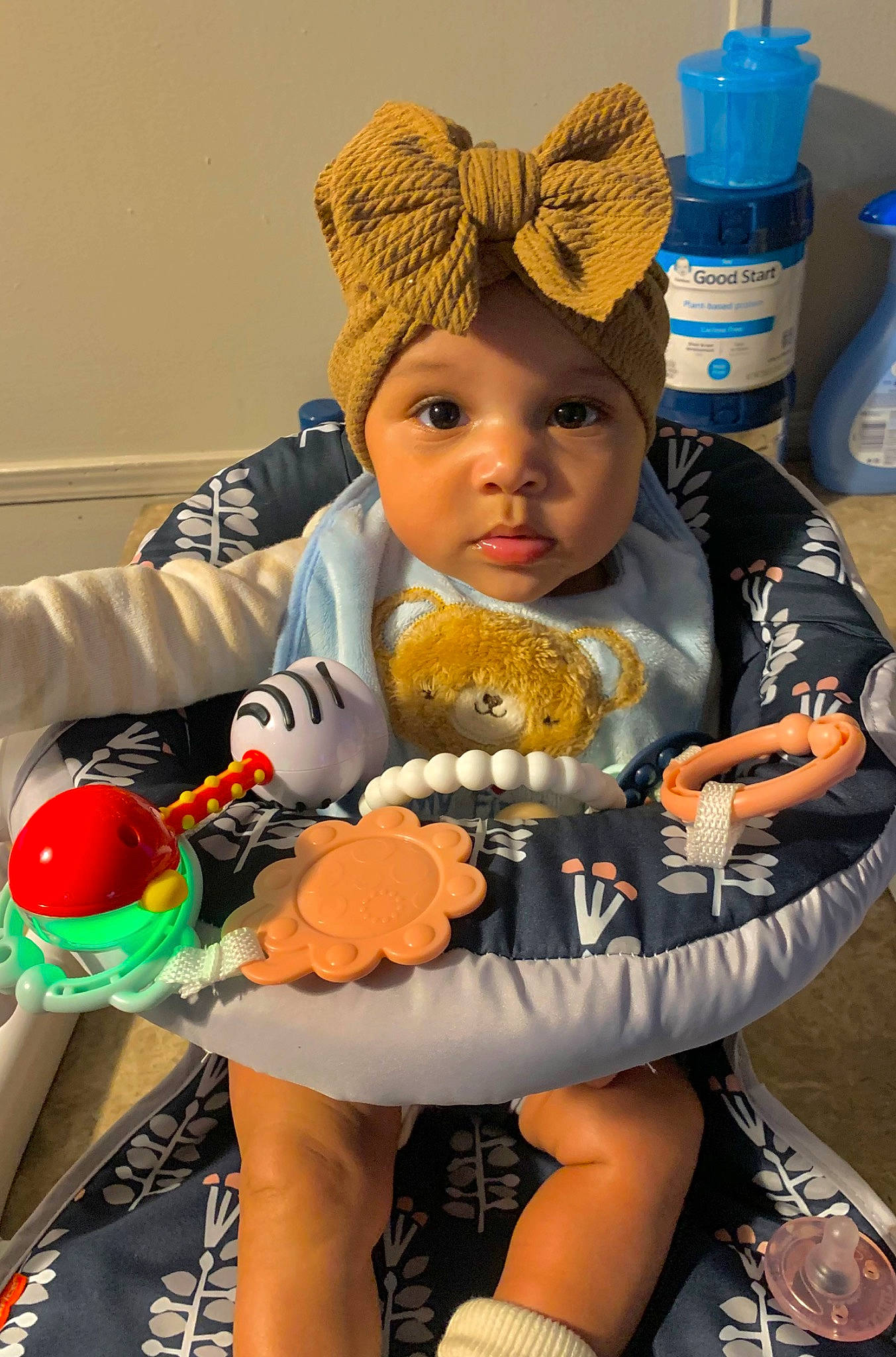 Zhavia is registered to the contest to win money with this photo: baby, baby_products, baby_toddler_clothing, blue, cake, cap, chair, child, fun, happy, headwear, junk_food, orange, person, plastic_bottle, sitting, stuffed_toy, sweetness, thigh, toddler