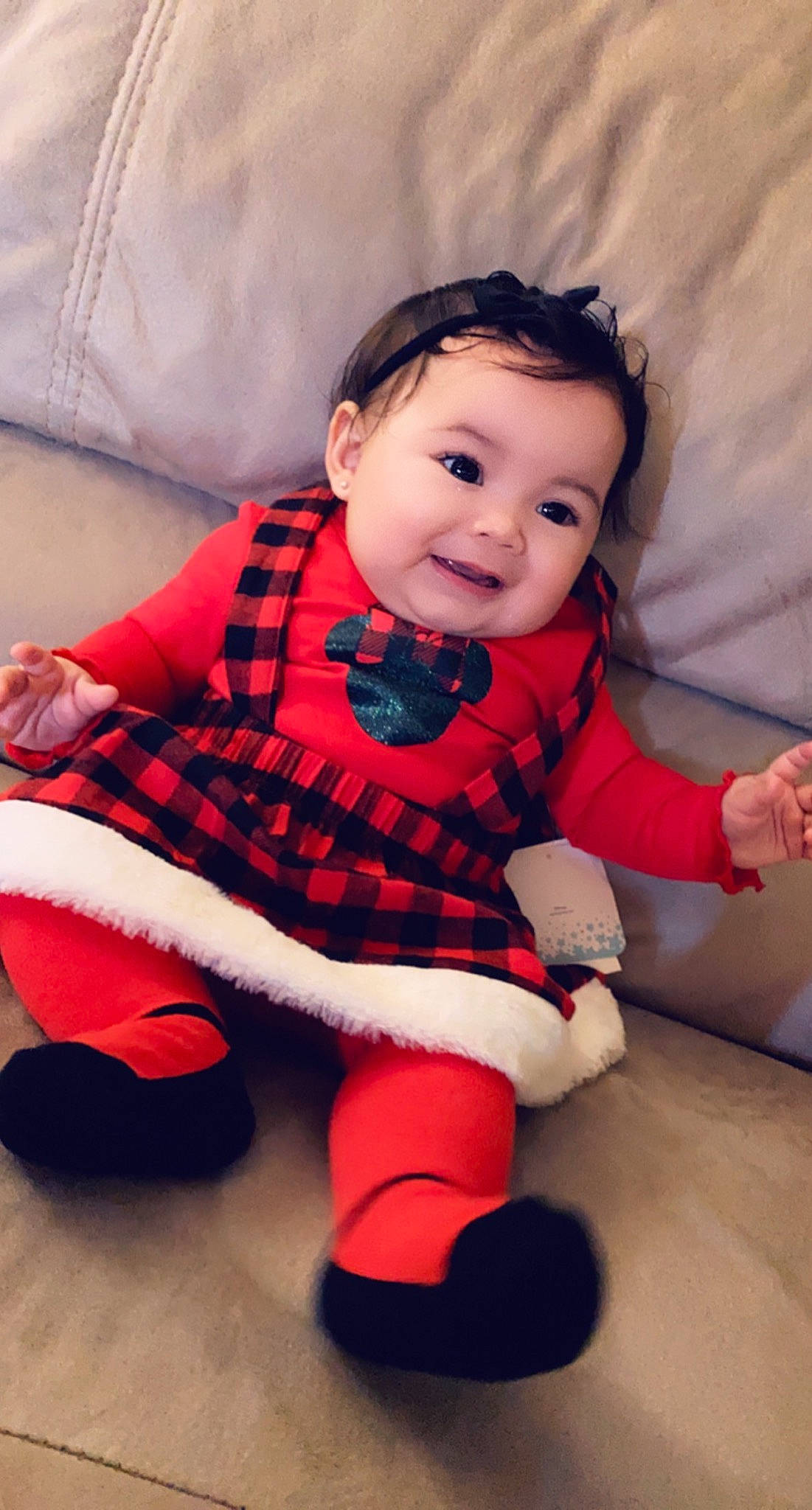 Alizee is registered to the contest to win money with this photo: baby, baby_products, baby_toddler_clothing, baby_toys, carmine, child, human_body, joy, linens, mouth, nose, overall, pattern, person, plaid, pleased, sock, stuffed_toy, tartan, textile