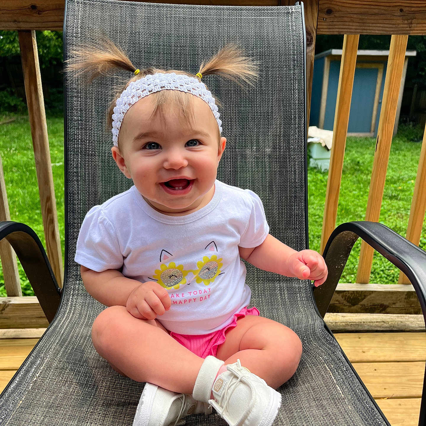 Natalia joined the competition — help win amazing prizes! baby, backyard, child, cute, fashion, greenery, happy, headband, outdoor_chair, person, pigtails, pink_shorts, portrait, sitting, smiling, summer, sunlight, white_shirt, white_shoes, wooden_deck