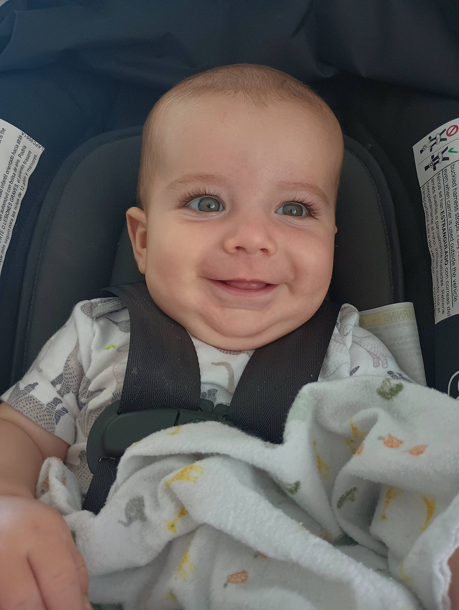 Waylon is registered to the contest to win money with this photo: auto_part, baby, baby_carriage, baby_in_car_seat, baby_products, baby_safety, baby_toddler_clothing, car_seat, cheek, child, comfort, finger, gesture, happy, joy, linens, person, seat_belt, skin, smile