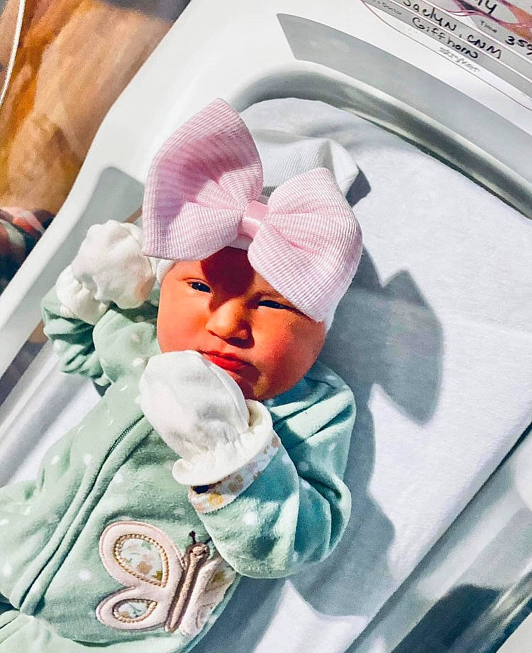 June is registered to the contest to win money with this photo: baby, baby_carriage, baby_products, baby_safety, baby_sleeping, baby_toddler_clothing, beanie, bedding, cap, car_seat, child, comfort, family_car, headwear, infant_bed, linens, person, room, sleeve, toddler