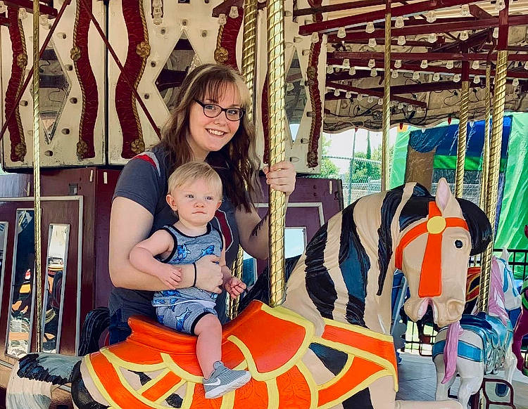 Jasper joined the competition — help win amazing prizes! amusement_park, amusement_ride, baby, carousel, child, event, fun, happy, joy, leisure, nonbuilding_structure, people, person, play, recreation, room, sitting, smile, t_shirt, toddler