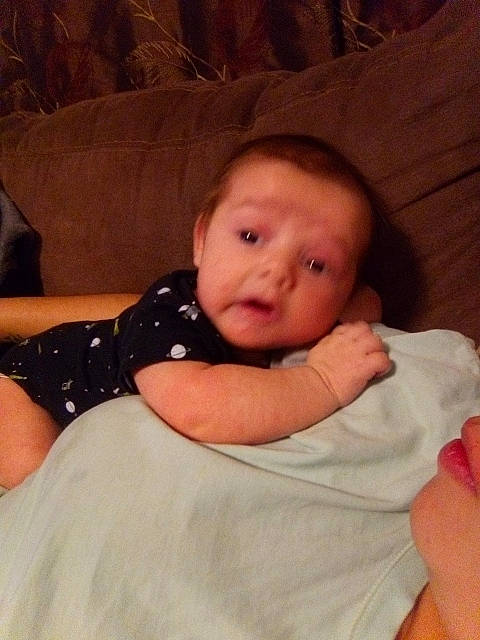 Enrique joined the competition — help win amazing prizes! baby, baby_toddler_clothing, cheek, child, chin, comfort, elbow, finger, head, iris, linens, nose, pattern, person, room, sitting, skin, sleeve, thumb, toddler