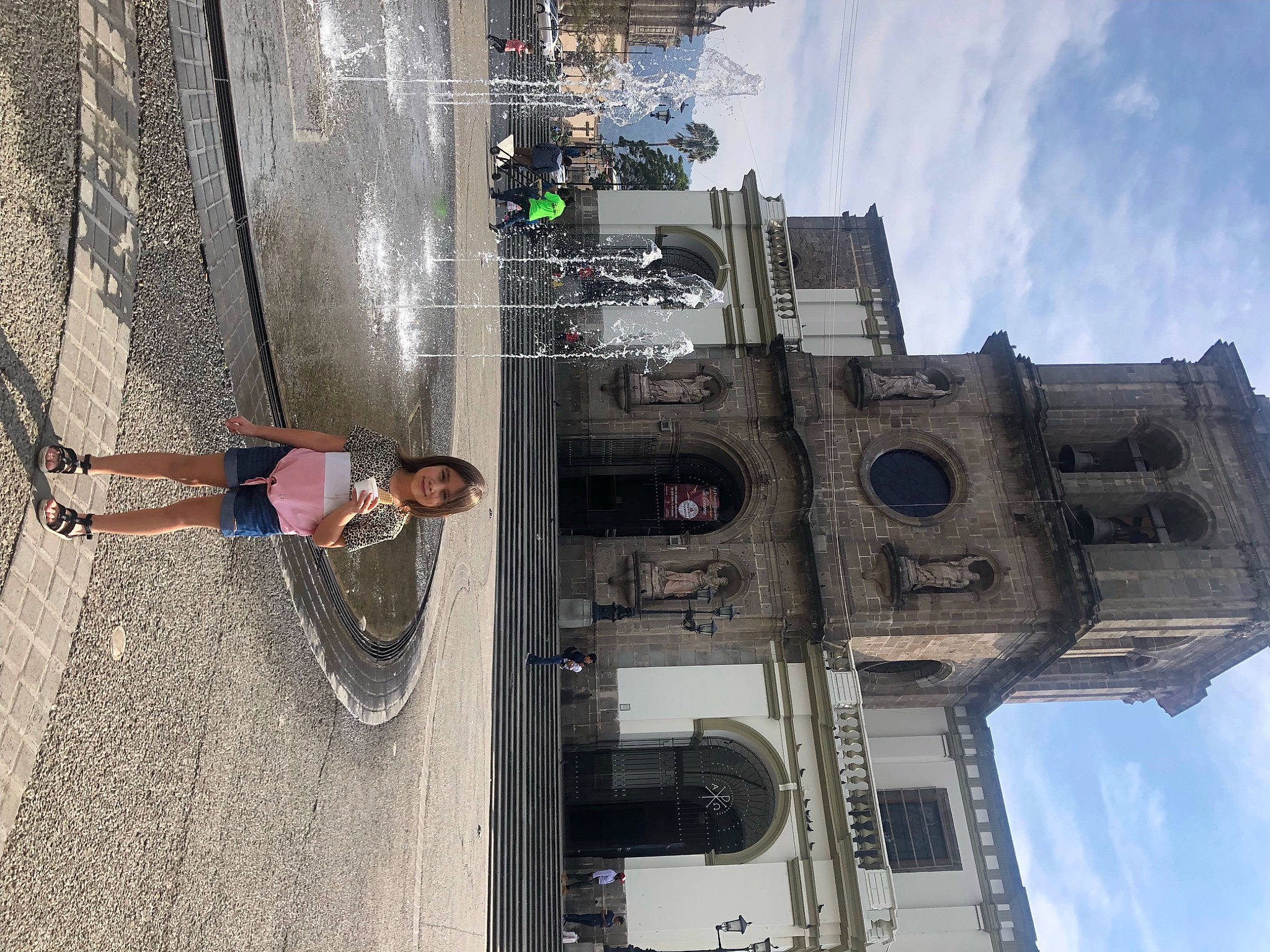 Lizette is registered to the contest to win money with this photo: art, building, city, cloud, concrete, electrical_supply, electricity, engineering, facade, joy, machine, metal, pedestrian, person, sky, smile, t_shirt, tower, travel, turret